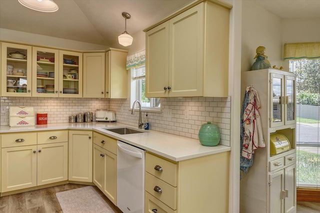 4307 S Apollo St, Spokane, WA 99223 - kitchen featuring dishwasher, a sink, cream cabinetry, light wood-type flooring, and vaulted ceiling