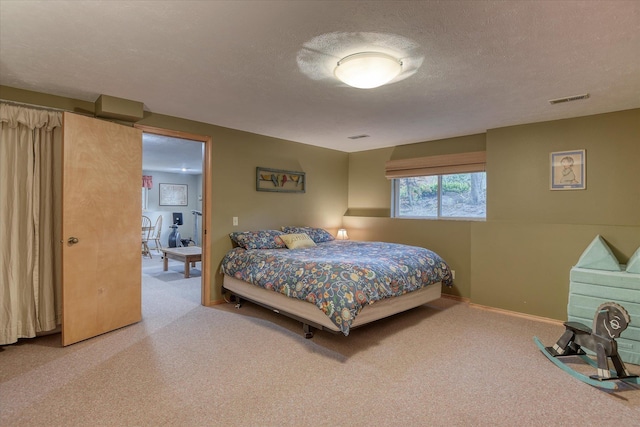 4307 S Apollo St, Spokane, WA 99223 - carpeted bedroom with baseboards and a textured ceiling