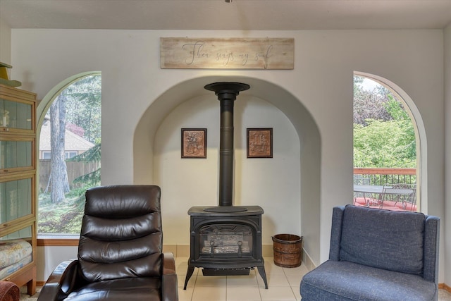 4307 S Apollo St, Spokane, WA 99223 - tiled living area with a wood stove and arched walkways
