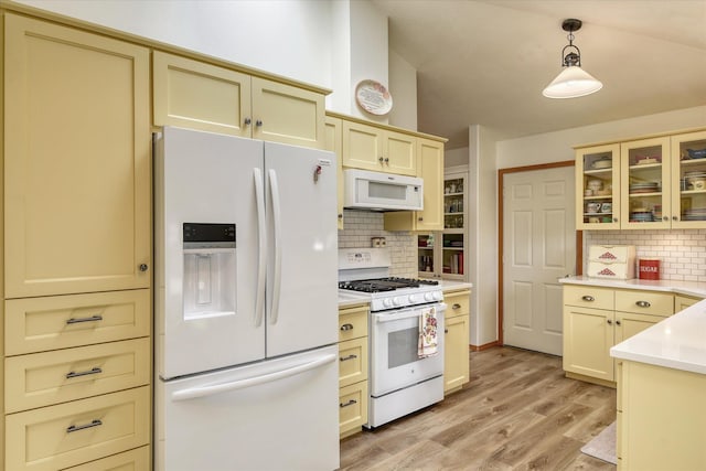4307 S Apollo St, Spokane, WA 99223 - kitchen featuring white appliances, tasteful backsplash, light countertops, and light wood-type flooring