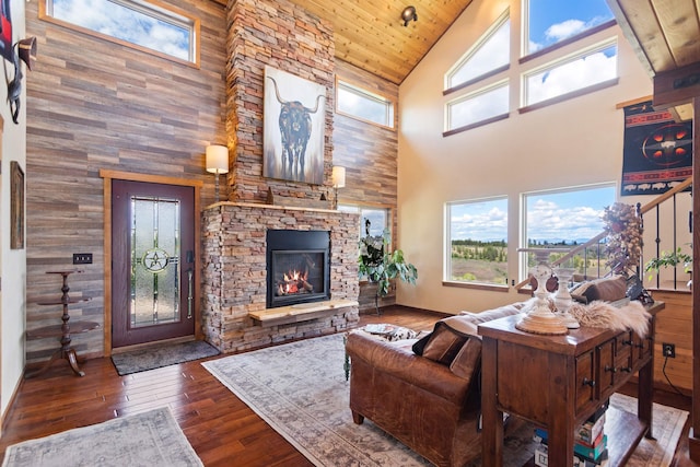 14410 W Jacobs Rd, Spokane, WA 99224 - living room featuring high vaulted ceiling, wood finished floors, a fireplace, baseboards, and wood ceiling