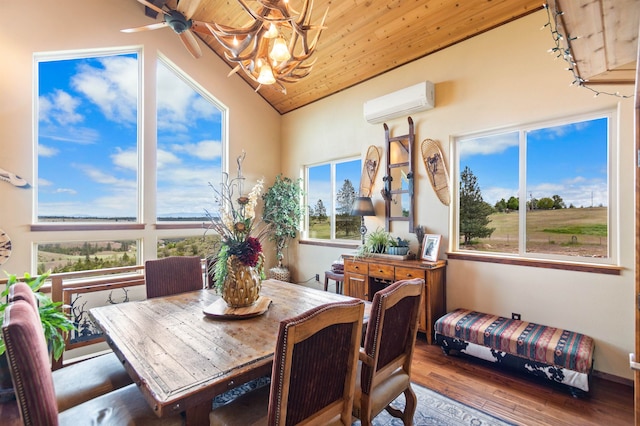14410 W Jacobs Rd, Spokane, WA 99224 - dining area with a wall mounted air conditioner, a chandelier, wood ceiling, hardwood / wood-style flooring, and vaulted ceiling