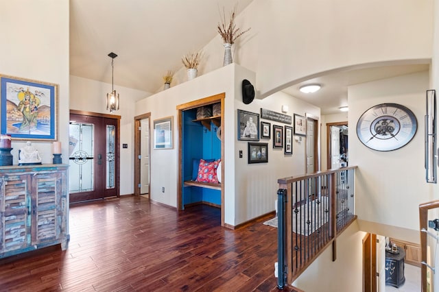 14410 W Jacobs Rd, Spokane, WA 99224 - entryway with wood finished floors, high vaulted ceiling, arched walkways, and baseboards