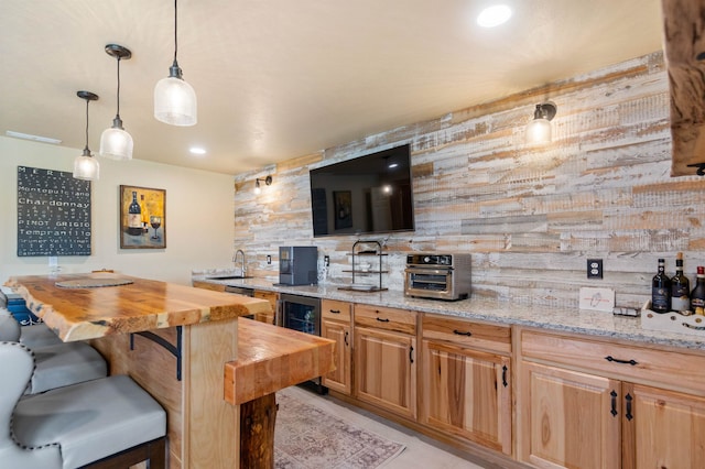 14410 W Jacobs Rd, Spokane, WA 99224 - kitchen featuring butcher block counters, a sink, beverage cooler, a kitchen breakfast bar, and decorative light fixtures