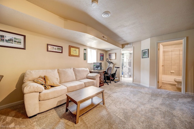 4112 E 11th Ave, Spokane, WA 99202 - living room featuring an office area, carpet, a textured ceiling, and baseboards