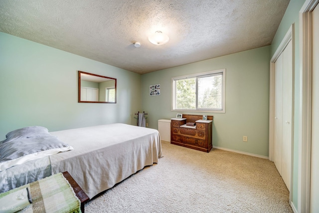 4112 E 11th Ave, Spokane, WA 99202 - carpeted bedroom with a textured ceiling and baseboards
