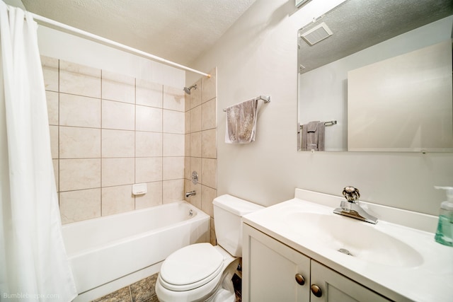 4112 E 11th Ave, Spokane, WA 99202 - bathroom featuring shower / tub combo, toilet, vanity, and a textured ceiling