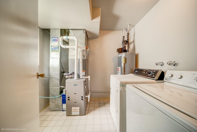 4112 E 11th Ave, Spokane, WA 99202 - washroom featuring independent washer and dryer, water heater, baseboards, and heating unit