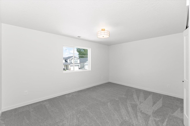 2077 W Walker Ave, Spokane, WA 99208 - empty room with carpet floors and baseboards