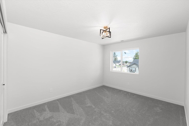2077 W Walker Ave, Spokane, WA 99208 - spare room featuring carpet floors and baseboards