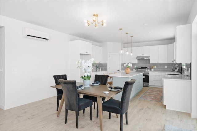 2077 W Walker Ave, Spokane, WA 99208 - dining area featuring a wall unit AC, a chandelier, light wood-style flooring, baseboards, and recessed lighting
