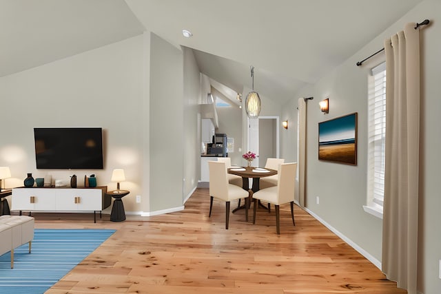 3016 N Walnut Street On A Dead End Street, Spokane, WA 99205 - living room featuring lofted ceiling, wood finished floors, and baseboards
