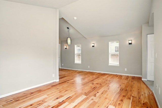 3016 N Walnut Street On A Dead End Street, Spokane, WA 99205 - unfurnished room featuring vaulted ceiling, light wood-type flooring, and baseboards