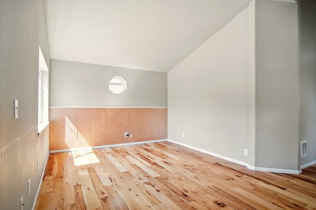 3016 N Walnut Street On A Dead End Street, Spokane, WA 99205 - additional living space with hardwood / wood-style floors, lofted ceiling, and baseboards