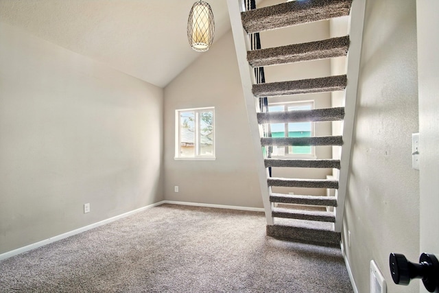 3016 N Walnut Street On A Dead End Street, Spokane, WA 99205 - stairs with carpet floors, baseboards, and lofted ceiling