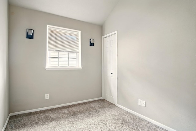 3016 N Walnut Street On A Dead End Street, Spokane, WA 99205 - spare room featuring carpet floors, baseboards, and vaulted ceiling