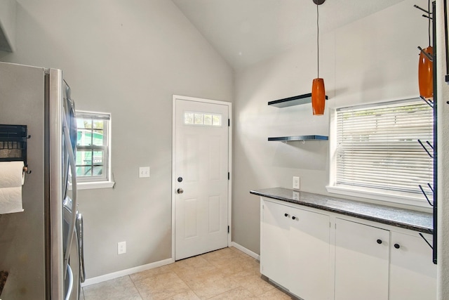 3016 N Walnut Street On A Dead End Street, Spokane, WA 99205 - kitchen with freestanding refrigerator, open shelves, healthy amount of natural light, white cabinetry, and high vaulted ceiling