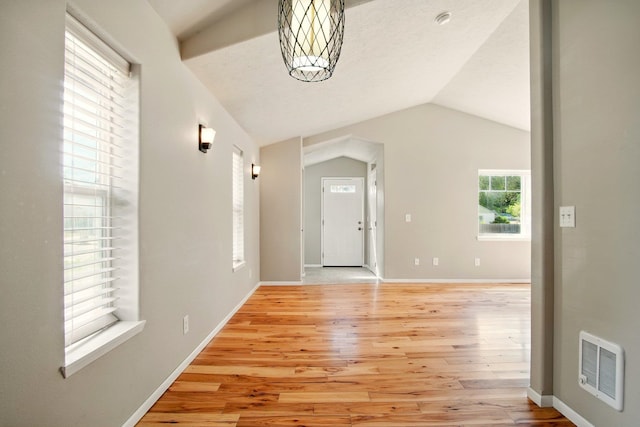 3016 N Walnut Street On A Dead End Street, Spokane, WA 99205 - foyer entrance featuring light wood finished floors, vaulted ceiling, and baseboards