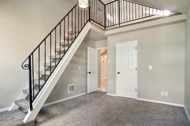 3016 N Walnut Street On A Dead End Street, Spokane, WA 99205 - stairway with carpet flooring, baseboards, and a high ceiling