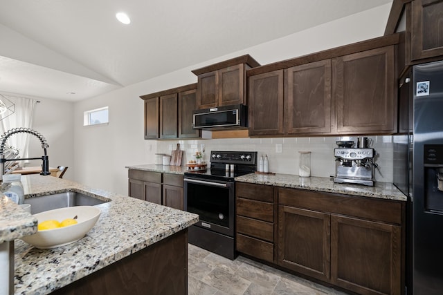 2026 W Parkway Ct, Spokane, WA 99208 - kitchen with black appliances, a sink, tasteful backsplash, dark brown cabinets, and lofted ceiling