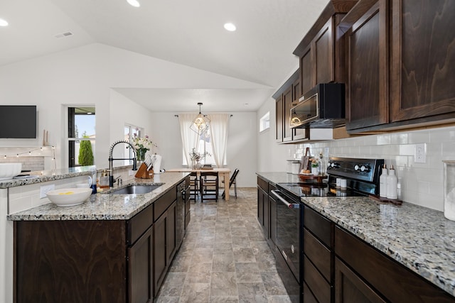 2026 W Parkway Ct, Spokane, WA 99208 - kitchen with black range with electric cooktop, a sink, lofted ceiling, decorative backsplash, and dark brown cabinetry