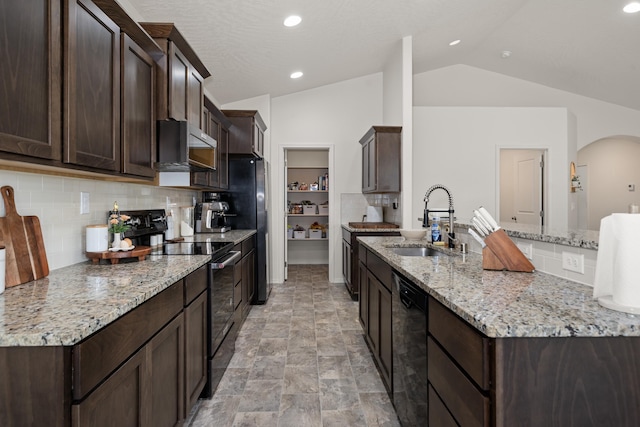 2026 W Parkway Ct, Spokane, WA 99208 - kitchen featuring black appliances, a sink, dark brown cabinetry, vaulted ceiling, and backsplash