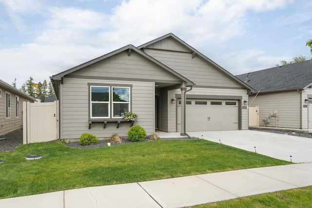 2026 W Parkway Ct, Spokane, WA 99208 - view of front of home with concrete driveway, an attached garage, and board and batten siding
