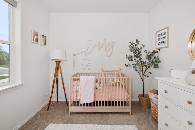 2026 W Parkway Ct, Spokane, WA 99208 - carpeted bedroom with a nursery area and baseboards