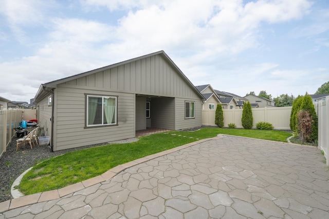 2026 W Parkway Ct, Spokane, WA 99208 - back of house with board and batten siding and a patio area