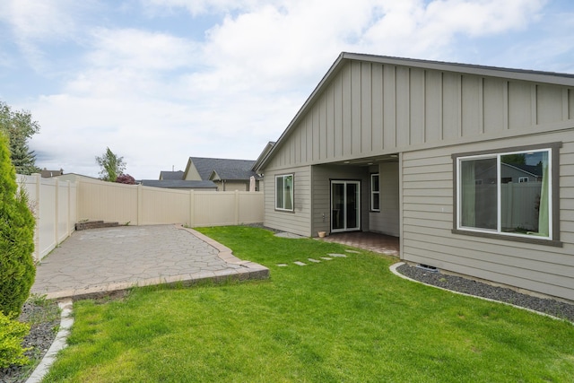 2026 W Parkway Ct, Spokane, WA 99208 - back of property with board and batten siding and a patio