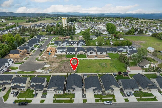 2026 W Parkway Ct, Spokane, WA 99208 - aerial view of property and surrounding area with nearby suburban area and a mountain backdrop