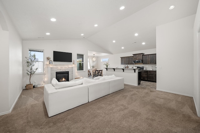 2026 W Parkway Ct, Spokane, WA 99208 - living area with light carpet, vaulted ceiling, recessed lighting, a brick fireplace, and baseboards