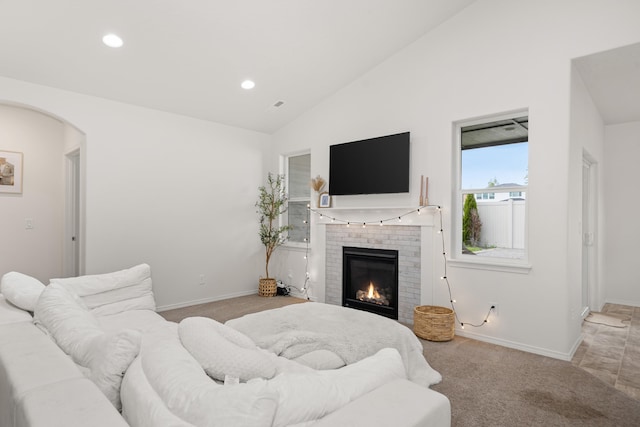 2026 W Parkway Ct, Spokane, WA 99208 - living area featuring light colored carpet, arched walkways, baseboards, a brick fireplace, and recessed lighting