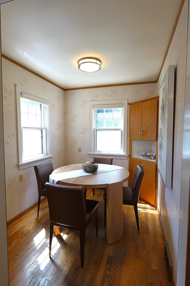 417 W 26th Ave, Spokane, WA 99203 - dining room with light wood-type flooring, ornamental molding, and baseboards