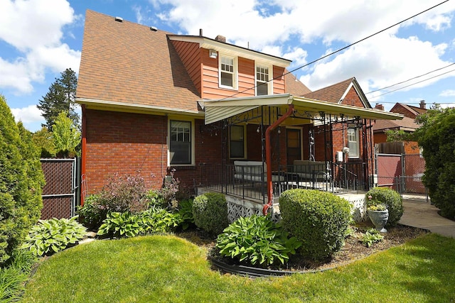 417 W 26th Ave, Spokane, WA 99203 - view of front of home featuring brick siding, a gate, roof with shingles, and a chimney