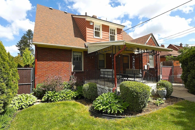 417 W 26th Ave, Spokane, WA 99203 - view of front of property with brick siding, roof with shingles, and a gate
