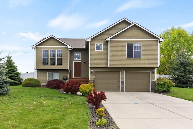 8710 N I Ct, Spokane, WA 99208 - bi-level home featuring a front yard, an attached garage, concrete driveway, and stone siding