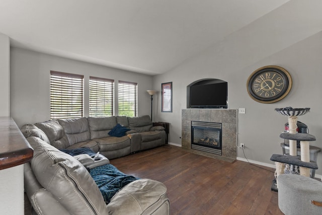 8710 N I Ct, Spokane, WA 99208 - living area featuring hardwood / wood-style flooring, a tile fireplace, baseboards, and vaulted ceiling