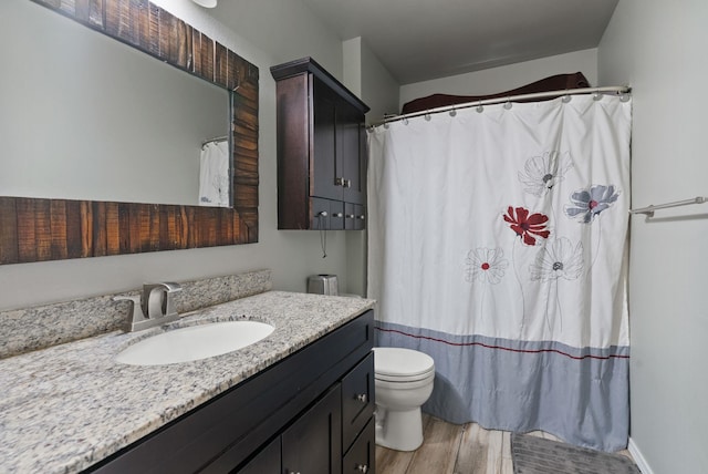 8710 N I Ct, Spokane, WA 99208 - bathroom featuring vanity, wood finished floors, toilet, and a shower with curtain