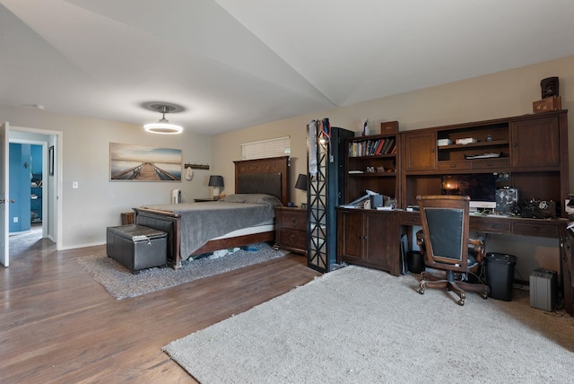 8710 N I Ct, Spokane, WA 99208 - bedroom featuring wood finished floors, a desk, vaulted ceiling, and baseboards