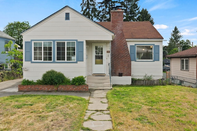 3215 W Longfellow Ave, Spokane, WA 99205 - bungalow-style home with a front yard and a chimney