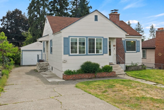3215 W Longfellow Ave, Spokane, WA 99205 - bungalow-style house featuring an outdoor structure, a chimney, a garage, entry steps, and roof with shingles