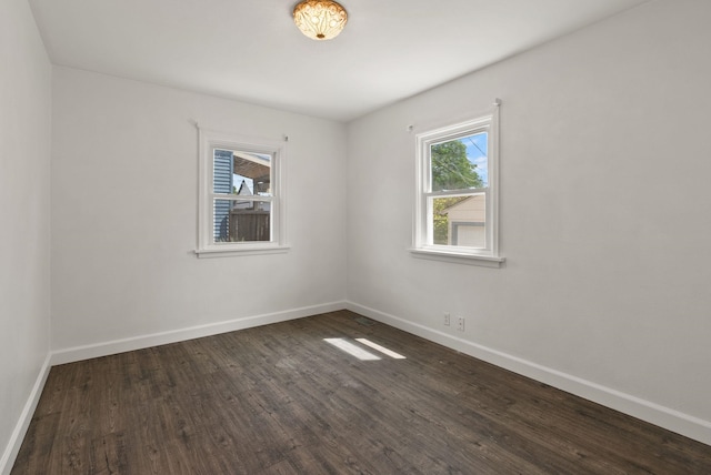 3215 W Longfellow Ave, Spokane, WA 99205 - spare room featuring baseboards and dark wood-style floors
