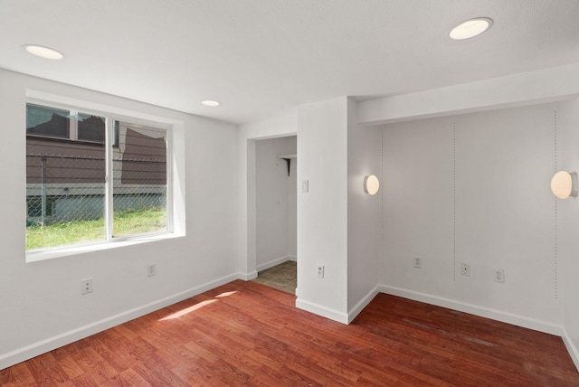 3215 W Longfellow Ave, Spokane, WA 99205 - spare room featuring wood finished floors, baseboards, and recessed lighting