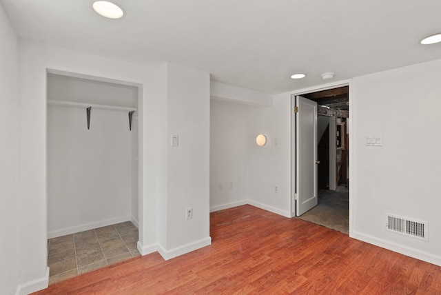 3215 W Longfellow Ave, Spokane, WA 99205 - unfurnished bedroom featuring a closet, baseboards, and a spacious closet