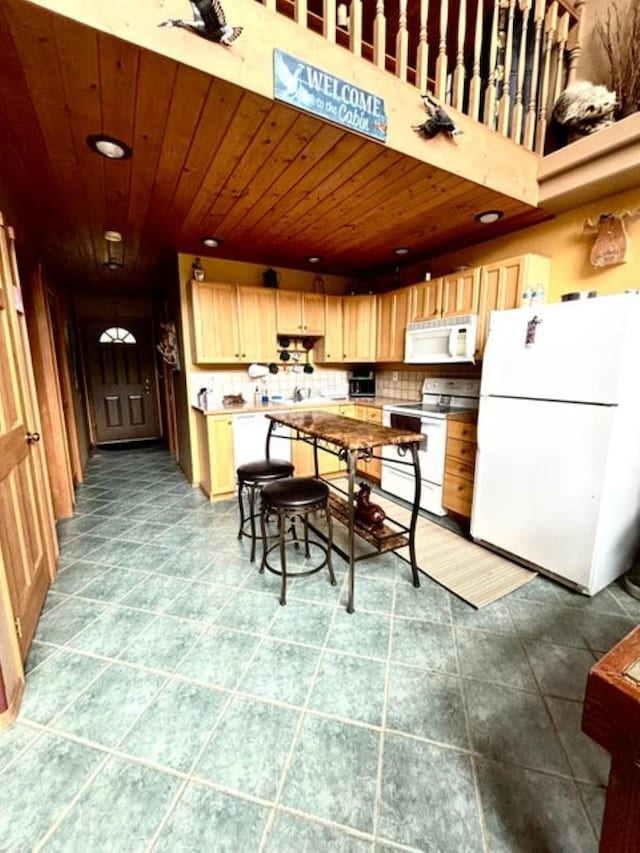 278 Hazel St, Cusick, WA 99119 - kitchen with white appliances, wood ceiling, tile patterned floors, decorative backsplash, and recessed lighting