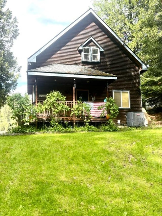 278 Hazel St, Cusick, WA 99119 - rear view of house featuring central air condition unit and a lawn