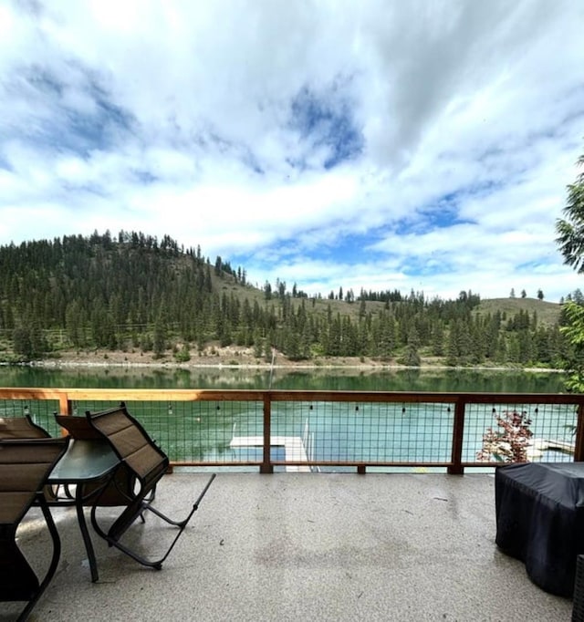 278 Hazel St, Cusick, WA 99119 - view of patio with a forest view and a water view