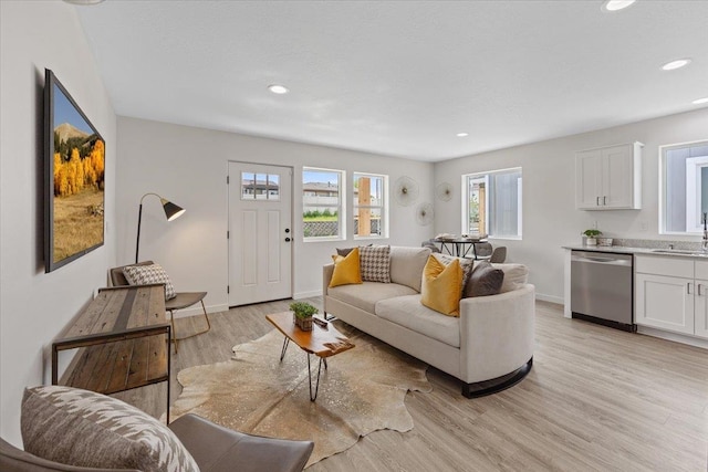 1912 W Buckeye Ave, Spokane, WA 99205 - living area with light wood-style floors, recessed lighting, and baseboards