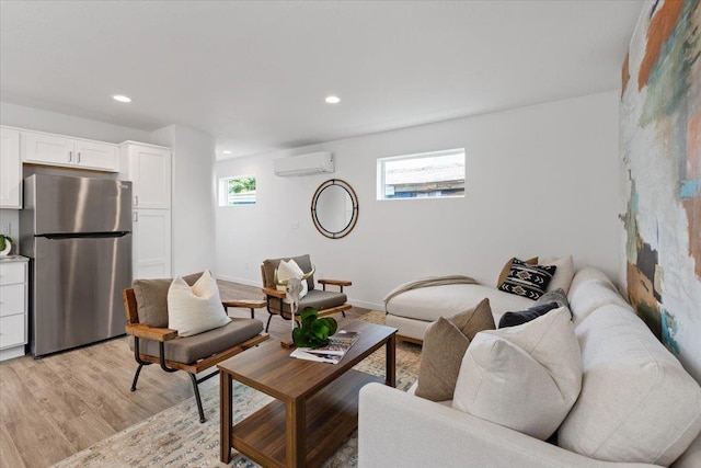 1912 W Buckeye Ave, Spokane, WA 99205 - living area featuring a wall unit AC, light wood-type flooring, recessed lighting, and baseboards